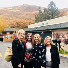 Caption: (L-R) Suzzanne Freeze, Jeanine Zlockie, Jean Winsor, and Rie Kennedy-Lizotte pose together outdoors in Salt Lake City.